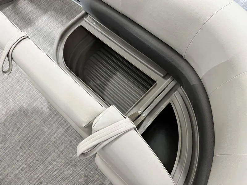 Slide: The Image of 2025 Sun Tracker PARTY BARGE® 16 DLX storage compartment with cushioned seating. - 6