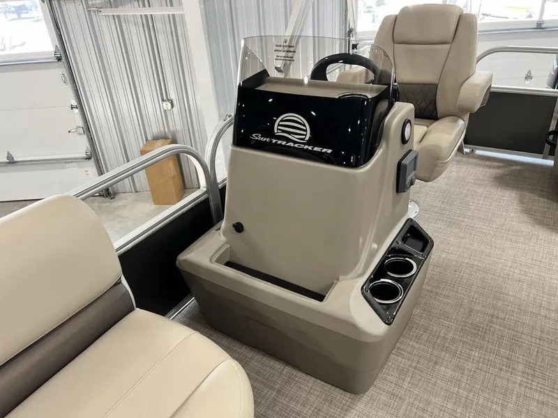 Slide: The Image of 2025 Sun Tracker PARTY BARGE® 16 DLX interior with steering console and seating. - 9