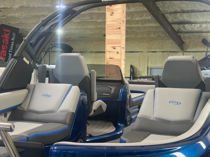 Slide: The Image of 2024 Manitou XT RFXW boat interior with modern seating and sleek design. - 4