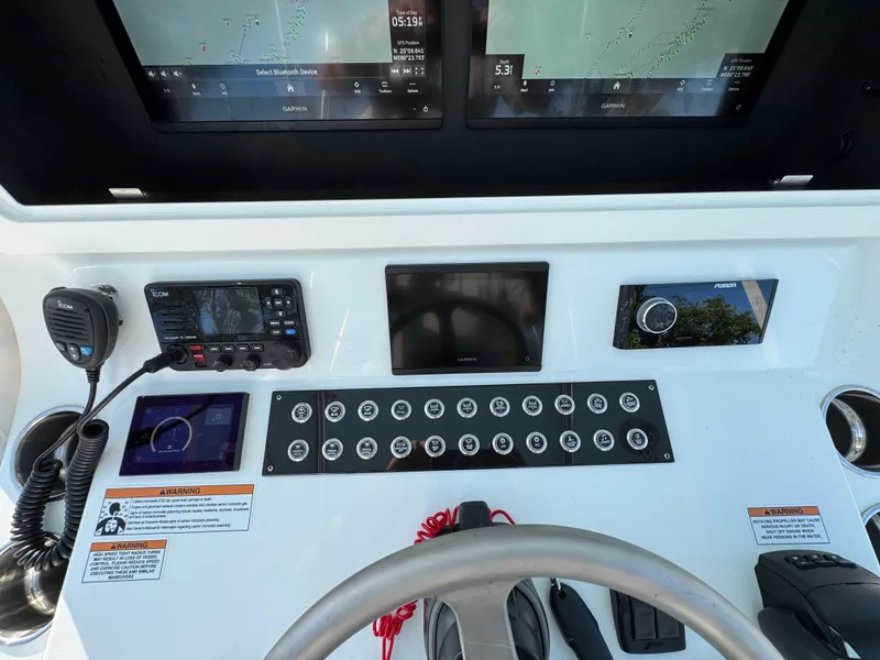 Slide: The Image of 2024 Contender 39 ST boat dashboard with advanced navigation and control systems. - 16