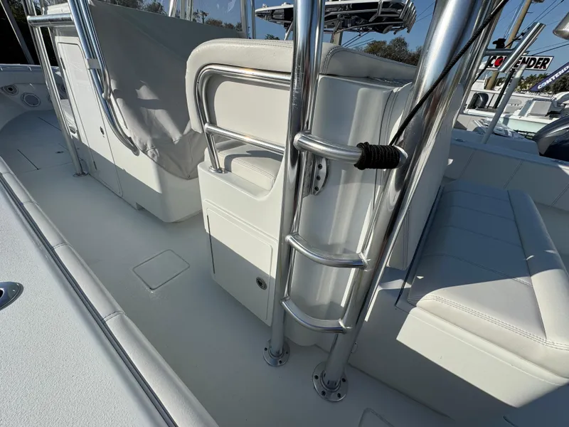 Slide: The Image of 2024 Contender 39 ST boat interior with sleek white seating and stainless steel fixtures. - 19