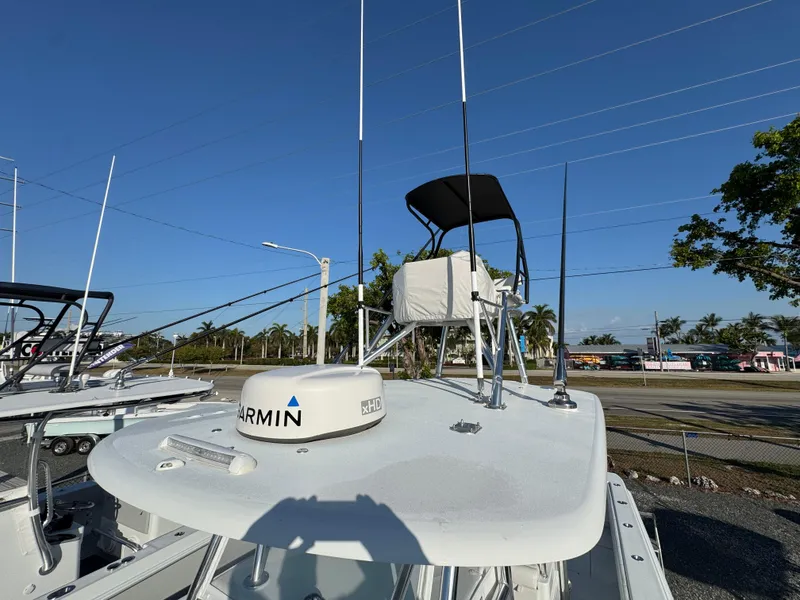 Slide: The Image of 2024 Contender 39 ST boat with Garmin radar, outdoor setting, clear blue sky. - 20