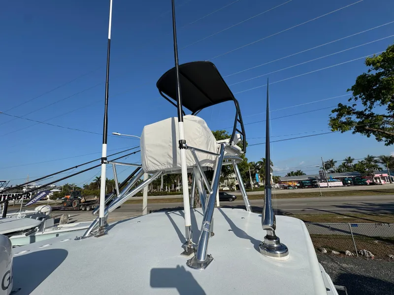 Slide: The Image of 2024 Contender 39 ST boat with tower and seating, under clear blue sky. - 22