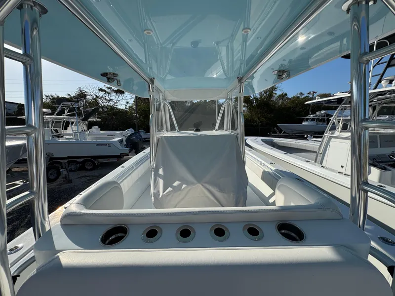 Slide: The Image of 2024 Contender 39 ST boat interior with sleek design and rod holders. - 27