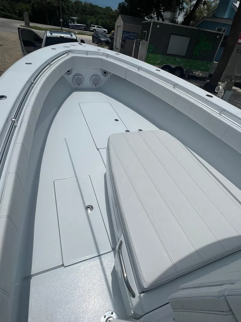 Slide: The Image of 2024 Contender 39 ST boat interior with sleek seating and storage compartments. - 3