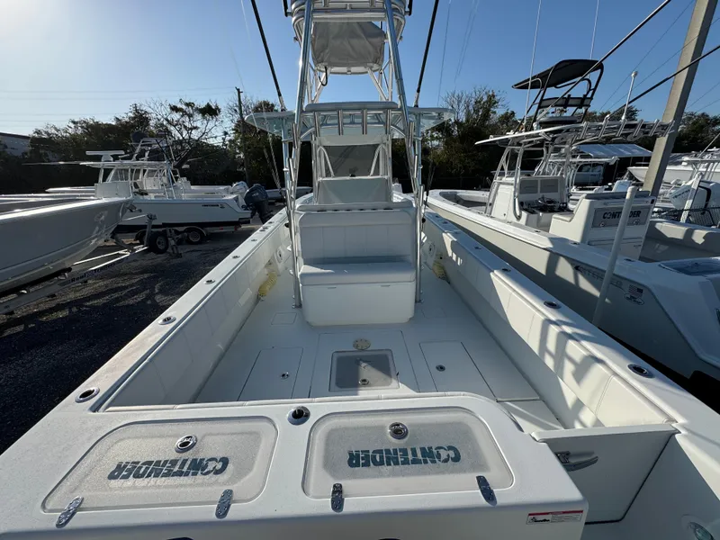 Slide: The Image of 2024 Contender 39 ST boat, spacious deck, sleek design, ideal for fishing and leisure activities. - 33