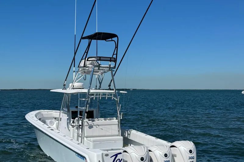 Slide: The Image of 2024 Contender 39 ST boat with triple engines on open water. - 4