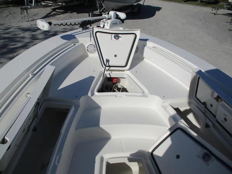 Slide: The Image of 2020 Regulator 26XO boat interior with open storage compartments and equipment. - 10