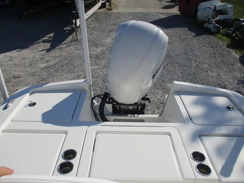 Slide: The Image of 2020 Regulator 26XO boat with outboard motor and storage compartments. - 14