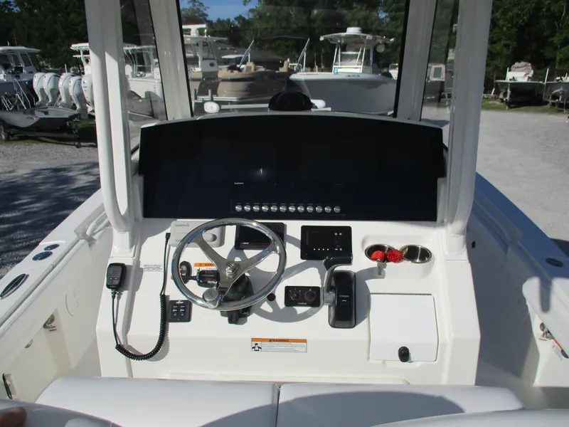 Slide: The Image of 2020 Regulator 26XO boat dashboard with steering wheel and controls. - 4