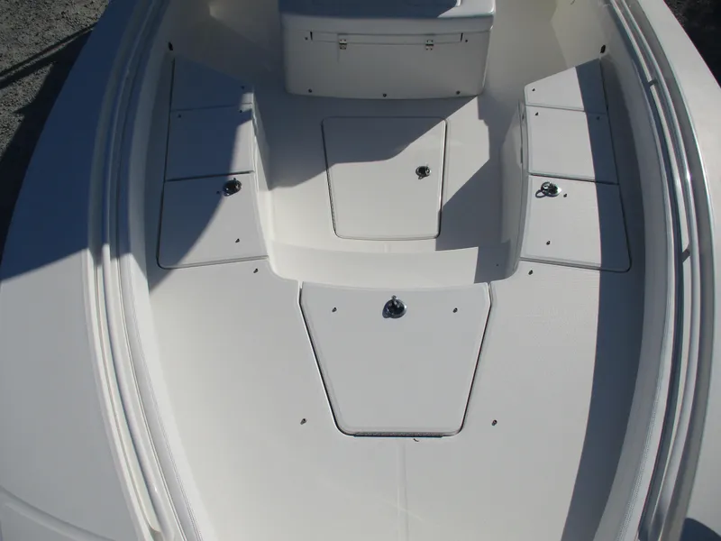 Slide: The Image of 2020 Regulator 26XO boat deck with storage compartments and sleek design. - 9