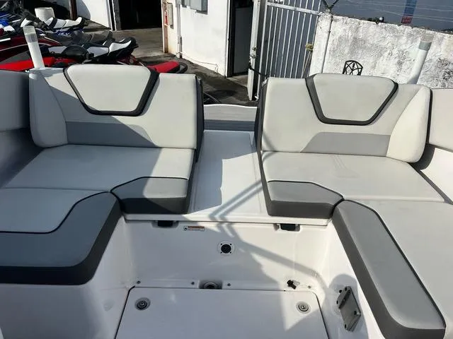 Slide: The Image of 2024 Yamaha Boats SX220 interior seating with modern gray upholstery. - 4