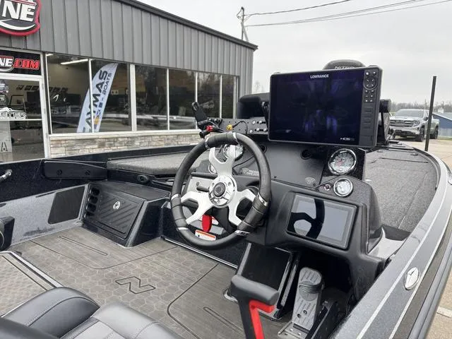Slide: The Image of 2024 Nitro Z21 XL Pro boat cockpit with steering wheel and navigation display. - 4