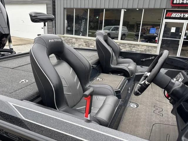 Slide: The Image of 2024 Nitro Z21 XL Pro boat interior with sleek black seating and modern dashboard. - 5