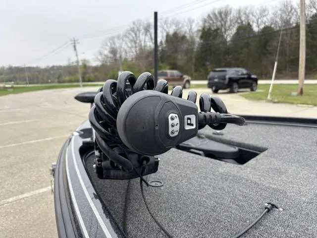 Slide: The Image of 2024 Nitro Z21 XL Pro boat with advanced trolling motor in a parking lot. - 8