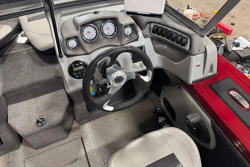 Slide: The Image of 2019 Tracker Targa V-19 Combo boat dashboard with steering wheel and gauges. - 10