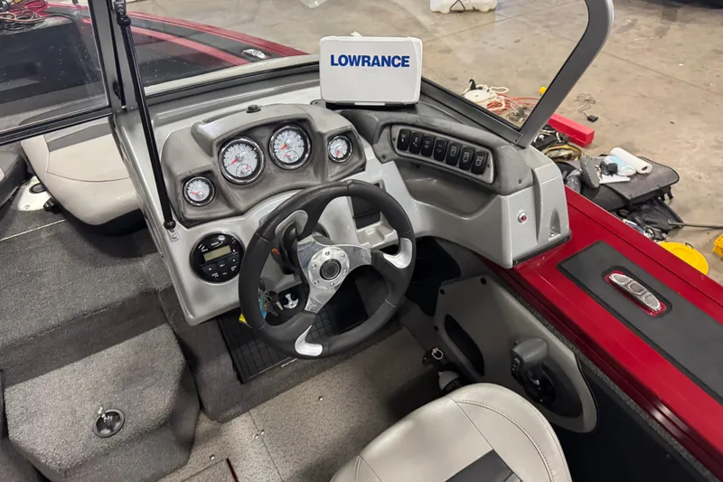 Slide: The Image of 2019 Tracker Targa V-19 Combo boat dashboard with Lowrance electronics and steering wheel. - 11