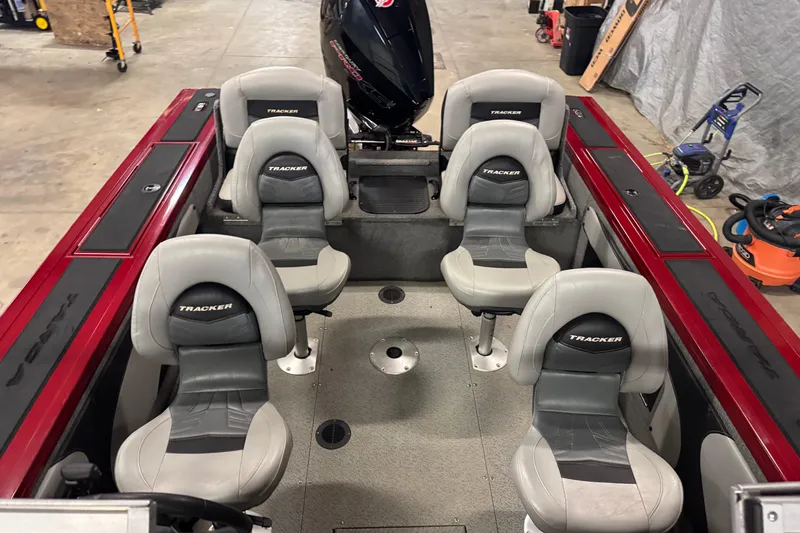 Slide: The Image of 2019 Tracker Targa V-19 Combo boat interior with six seats and motor. - 16