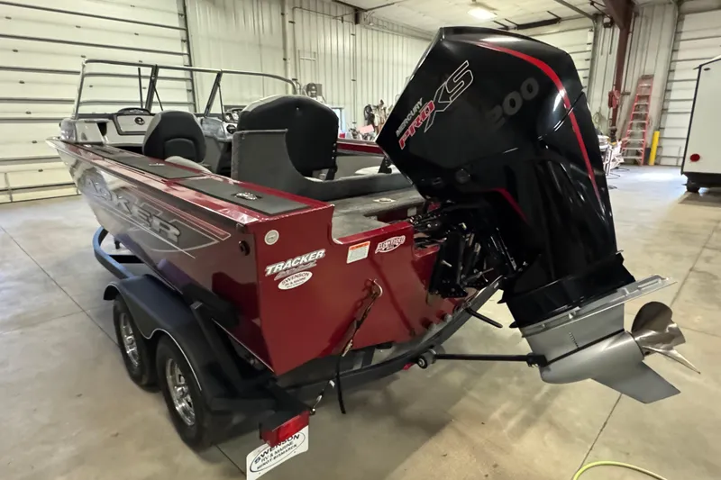 Slide: The Image of 2019 Tracker Targa V-19 Combo boat with Mercury Pro XS 200 engine in a garage. - 4