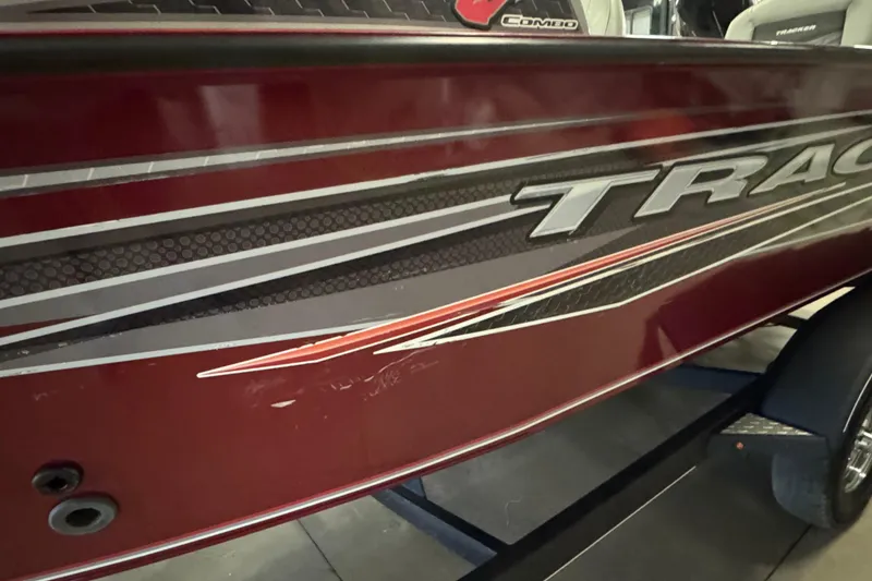 Slide: The Image of 2019 Tracker Targa V-19 Combo boat with red and gray detailing. - 5