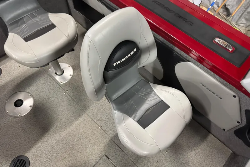 Slide: The Image of 2019 Tracker Targa V-19 Combo boat interior with gray and black seating. - 8