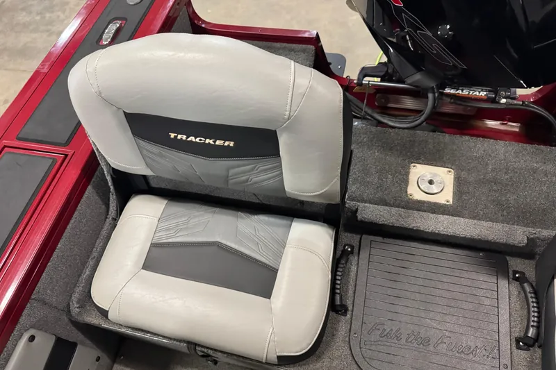 Slide: The Image of 2019 Tracker Targa V-19 Combo boat seat and deck, featuring gray upholstery and red accents. - 9
