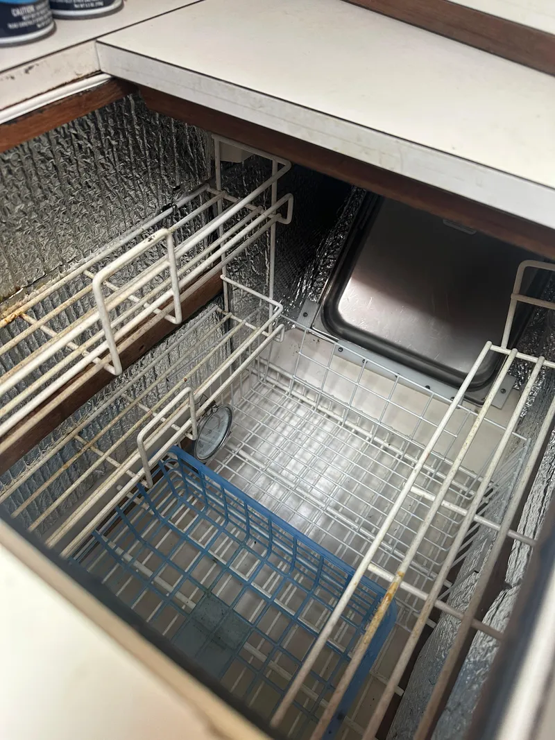 Slide: The Image of 1980 Morgan 382 yacht interior with built-in storage compartments and metallic finish. - 7