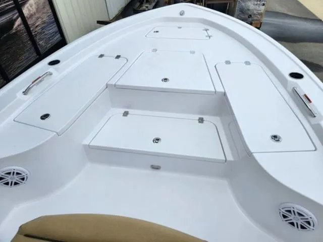 Slide: The Image of 2025 Sportsman Masters 247 boat deck with storage compartments and seating. - 10
