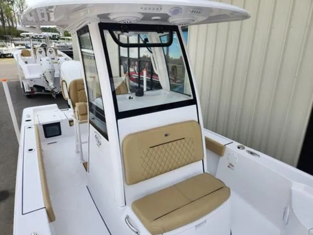 Slide: The Image of 2025 Sportsman Masters 247 boat with tan seating and modern console design. - 11