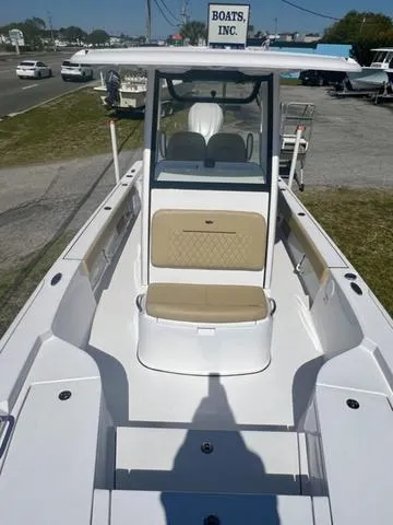 Slide: The Image of 2025 Sportsman Masters 247 boat with beige seating, displayed at Boats Inc. dealership. - 15