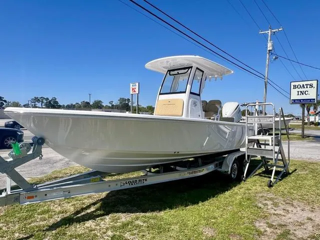 Slide: The Image of 2025 Sportsman Masters 247 boat on trailer at dealership, sunny day. - 16