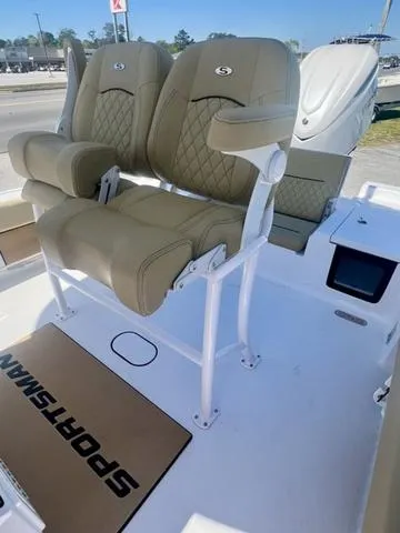 Slide: The Image of 2025 Sportsman Masters 247 boat with dual cushioned seats and sleek design. - 18