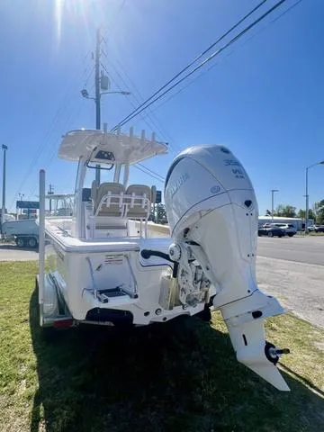 Slide: The Image of 2025 Sportsman Masters 247 boat interior storage compartment with wooden floor mat. - 3