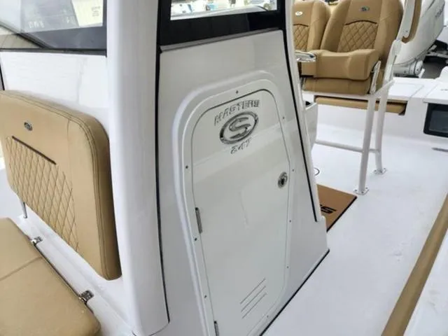 Slide: The Image of 2025 Sportsman Masters 247 boat deck with storage compartments and seating. - 7