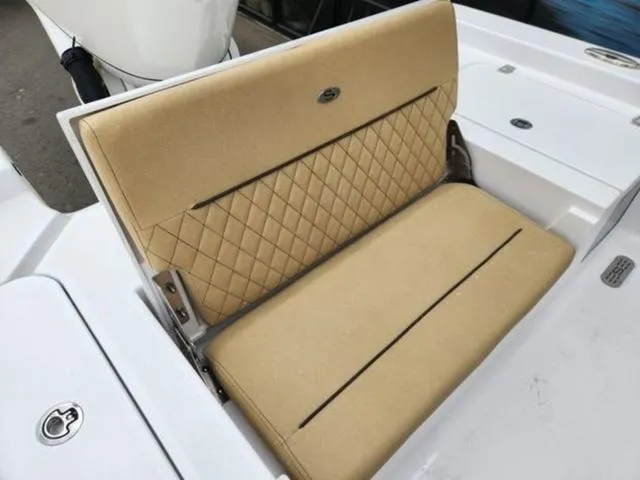 Slide: The Image of 2025 Sportsman Masters 247 boat with tan seating and modern console design. - 8