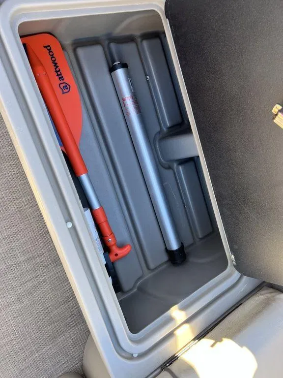 Slide: The Image of Storage compartment in 2021 Sun Tracker PARTY BARGE® 20 DLX with paddle and pole. - 22