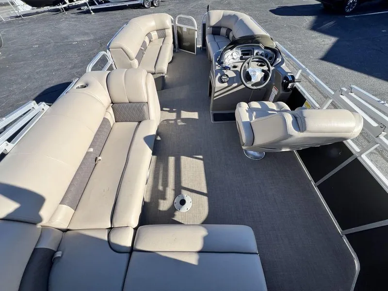 Slide: The Image of 2021 Sun Tracker PARTY BARGE® 20 DLX interior with spacious seating and helm. - 24