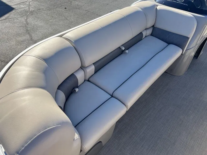 Slide: The Image of 2021 Sun Tracker PARTY BARGE® 20 DLX pontoon boat seating, featuring plush gray upholstery. - 9