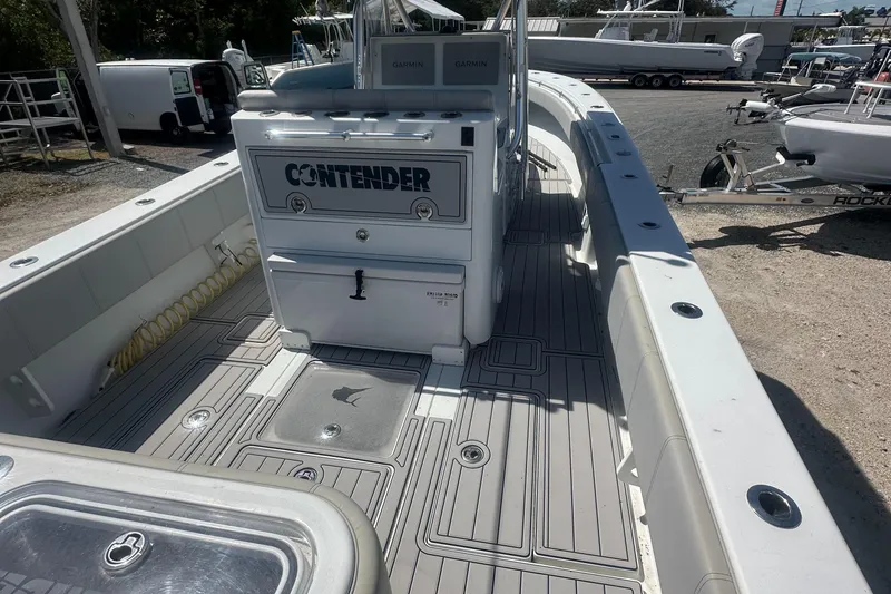 Slide: The Image of 2023 Contender 32 ST boat deck with storage and seating, featuring sleek design and ample space. - 11