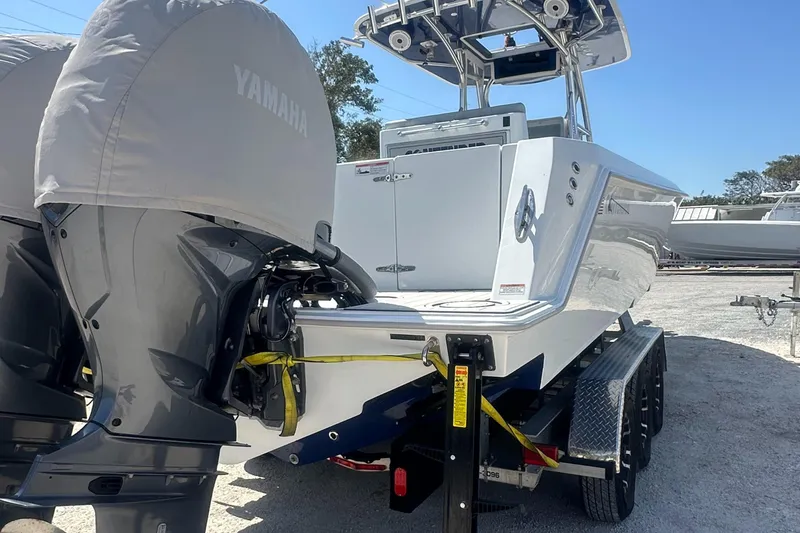 Slide: The Image of 2023 Contender 32 ST boat with Yamaha engines on a trailer. - 12