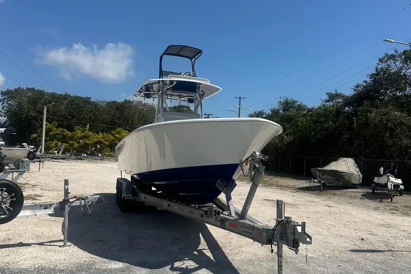 Slide: The Image of 2023 Contender 32 ST boat on trailer in outdoor setting. - 16