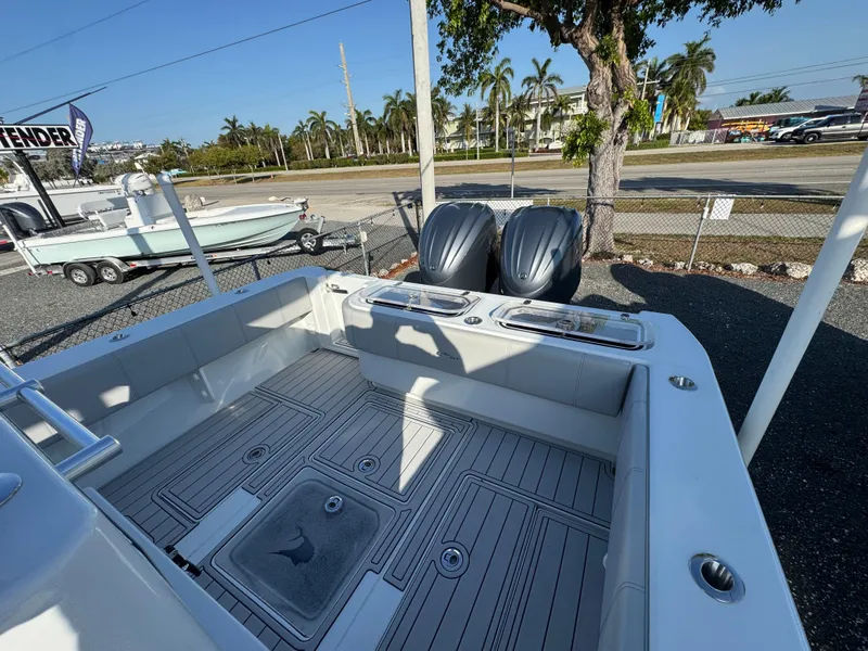 Slide: The Image of 2023 Contender 32 ST boat with dual engines, spacious deck, and sleek design. - 35