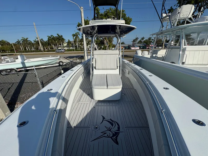 Slide: The Image of 2023 Contender 32 ST boat interior with seating and marlin design on deck. - 39