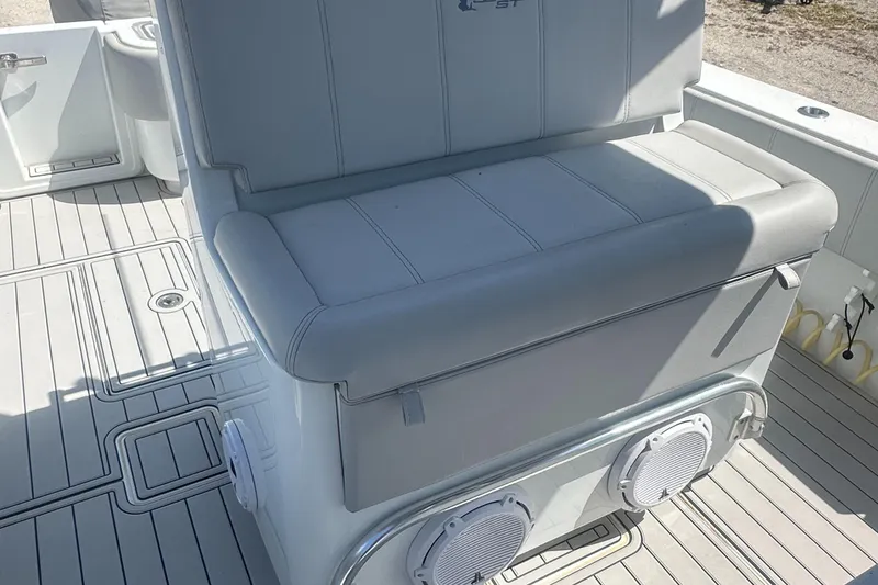 Slide: The Image of 2023 Contender 32 ST boat seat with integrated speakers on deck. - 9