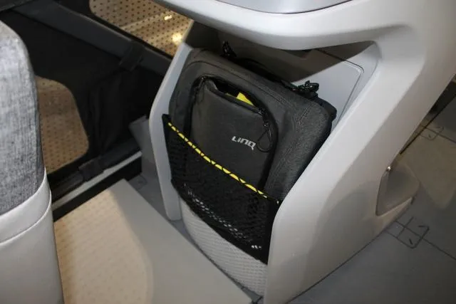 Slide: The Image of 2022 Sea-Doo Switch Sport 18 interior storage compartment with LinQ bag. - 11