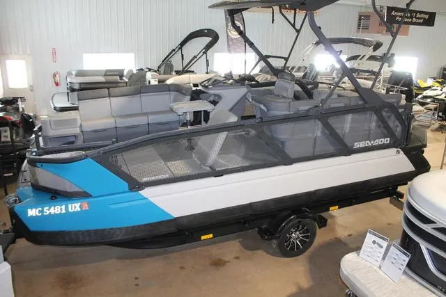 Slide: The Image of 2022 Sea-Doo Switch Sport 18, 230 hp, displayed indoors on a trailer. - 4