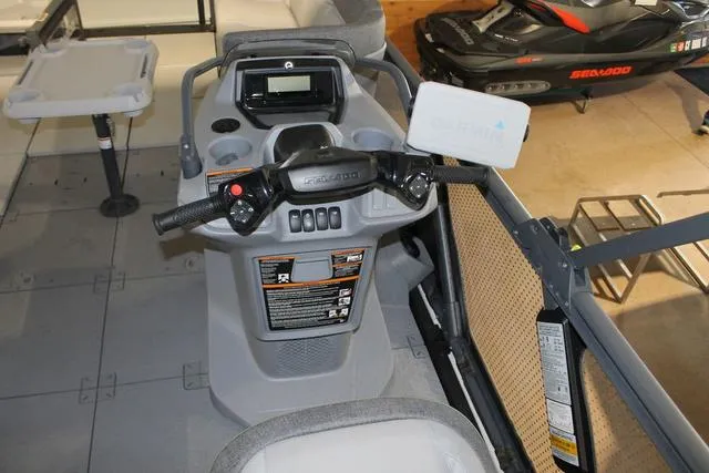 Slide: The Image of 2022 Sea-Doo Switch® Sport 18 dashboard with controls and display in a showroom. - 7
