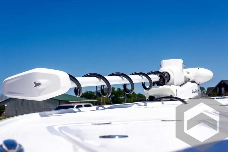Slide: The Image of 2025 Tidewater 2110 Bay Max boat with advanced trolling motor, clear blue sky background. - 19