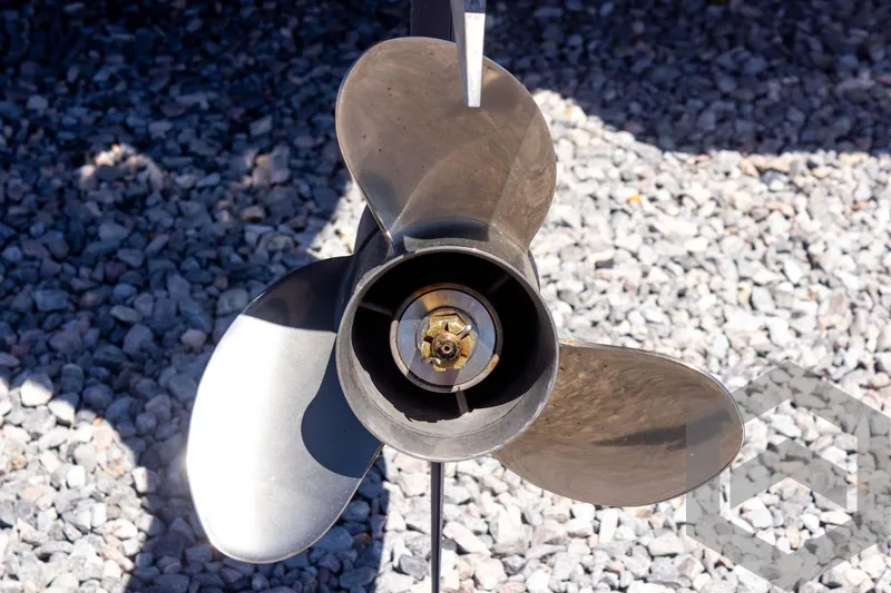 Slide: The Image of Propeller of 2025 Tidewater 2110 Bay Max boat on gravel surface. - 22