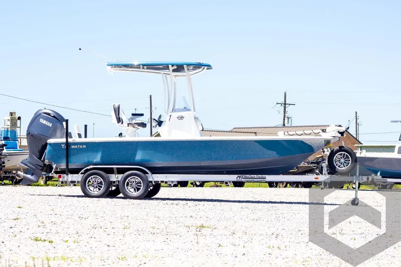 Slide: The Image of 2025 Tidewater 2110 Bay Max boat on trailer, blue hull, Yamaha outboard motor. - 4